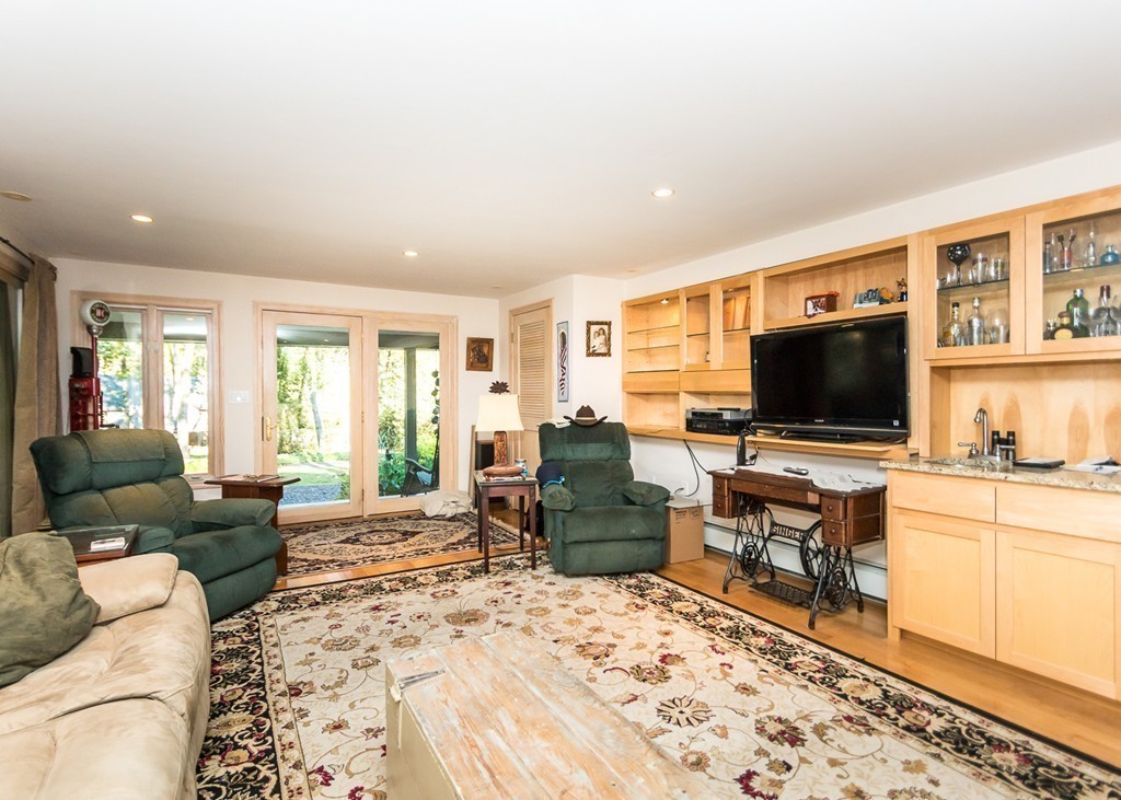 93 Old County Road Lincoln, MA 01773 - Photo 8 of 30 a living room with furniture and a flat screen tv