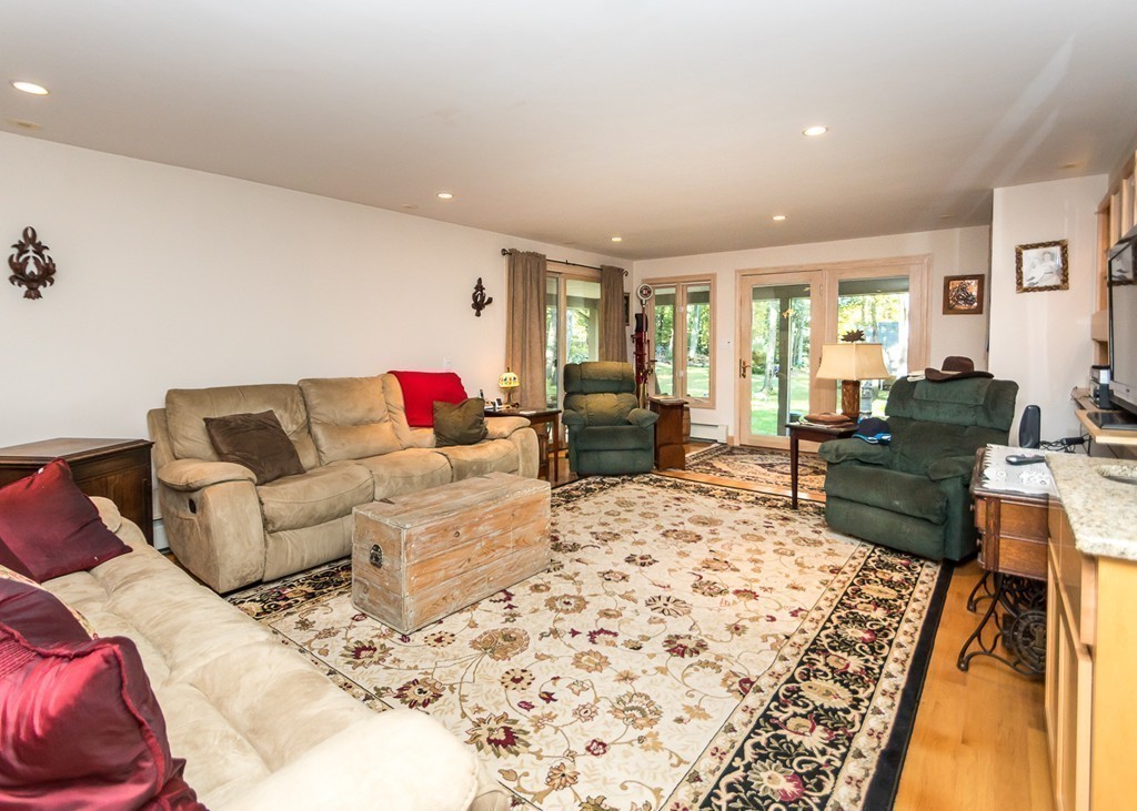 93 Old County Road Lincoln, MA 01773 - Photo 9 of 30 a living room with furniture fireplace and a table