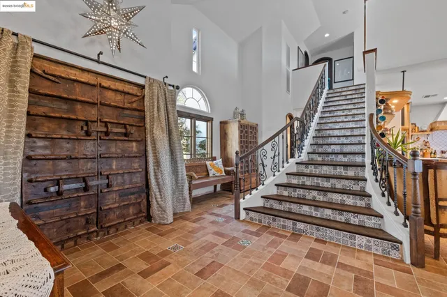 a view of entryway with stairs and wooden floor