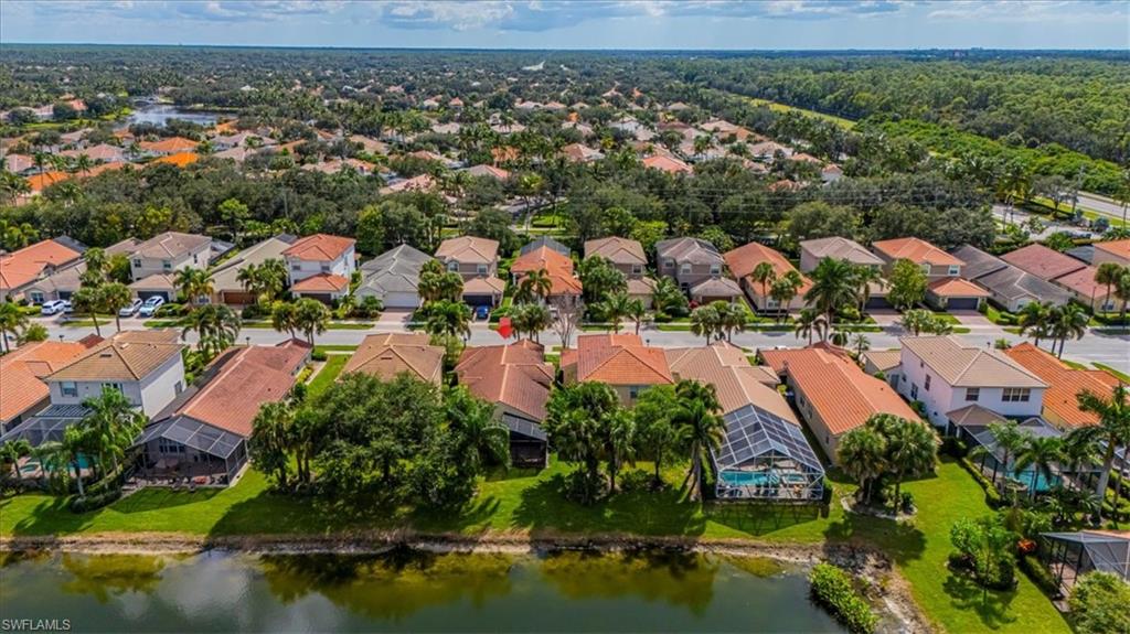 1630 Triangle Palm Terrace Naples, FL 34119 - Photo 23 of 24 an aerial view of residential houses with outdoor space and swimming pool