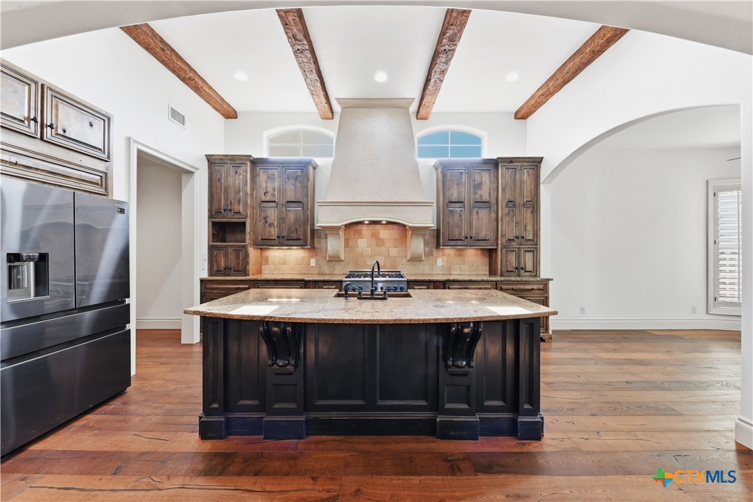 1108 Tuscan Ridge Drive New Braunfels, TX 78130 - Photo 16 of 47 a kitchen with stainless steel appliances granite countertop a sink stove and refrigerator