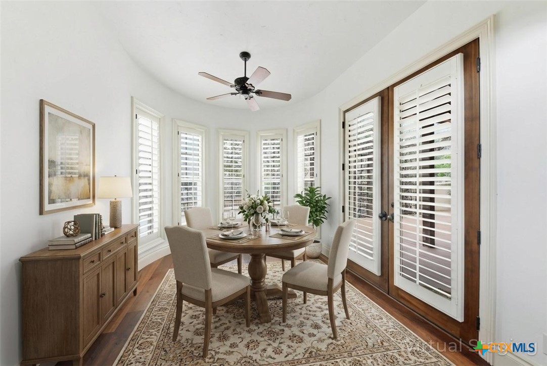 1108 Tuscan Ridge Drive New Braunfels, TX 78130 - Photo 20 of 47 a view of a dining room with furniture window and wooden floor