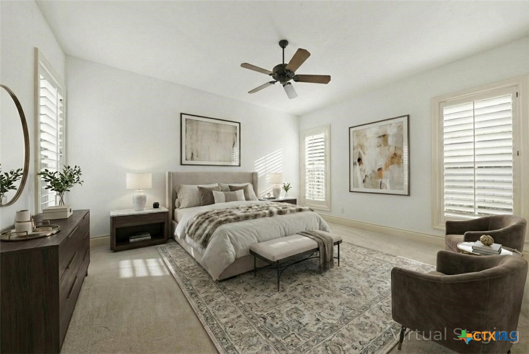 1108 Tuscan Ridge Drive New Braunfels, TX 78130 - Photo 22 of 47 a spacious bedroom with a bed a couch and a window