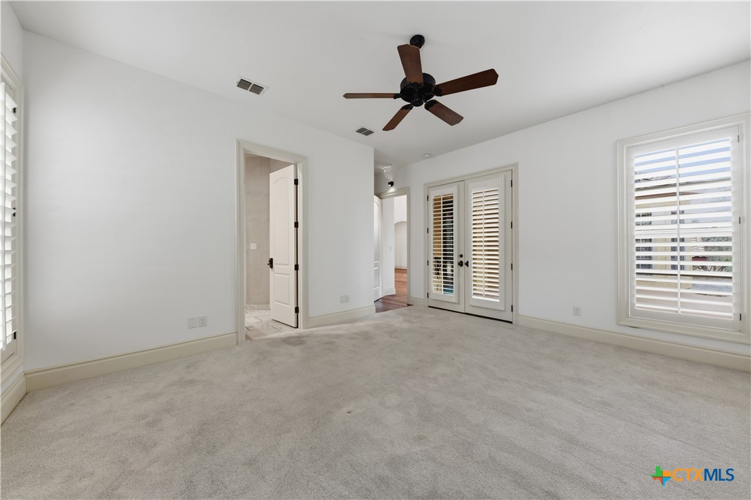 1108 Tuscan Ridge Drive New Braunfels, TX 78130 - Photo 23 of 47 a view of empty room with window and ceiling fan