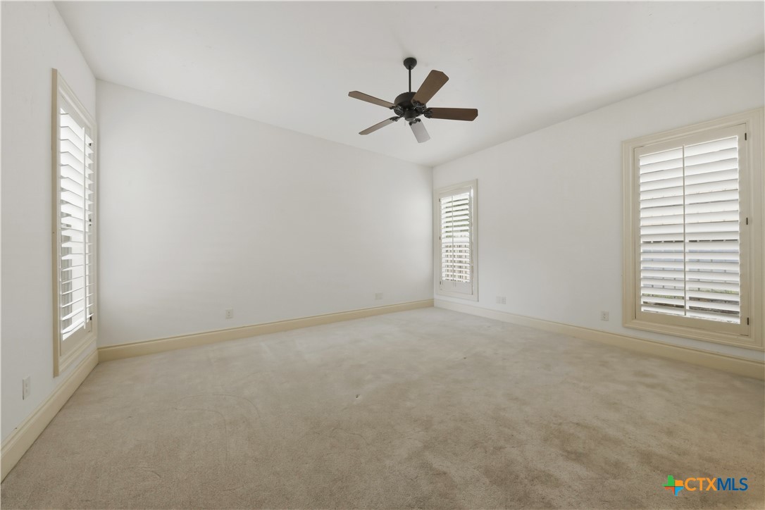 1108 Tuscan Ridge Drive New Braunfels, TX 78130 - Photo 24 of 47 a view of an empty room with a window