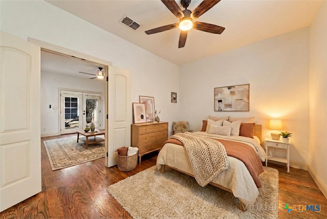 1108 Tuscan Ridge Drive New Braunfels, TX 78130 - Photo 38 of 47 a spacious bedroom with a bed and ceiling fan
