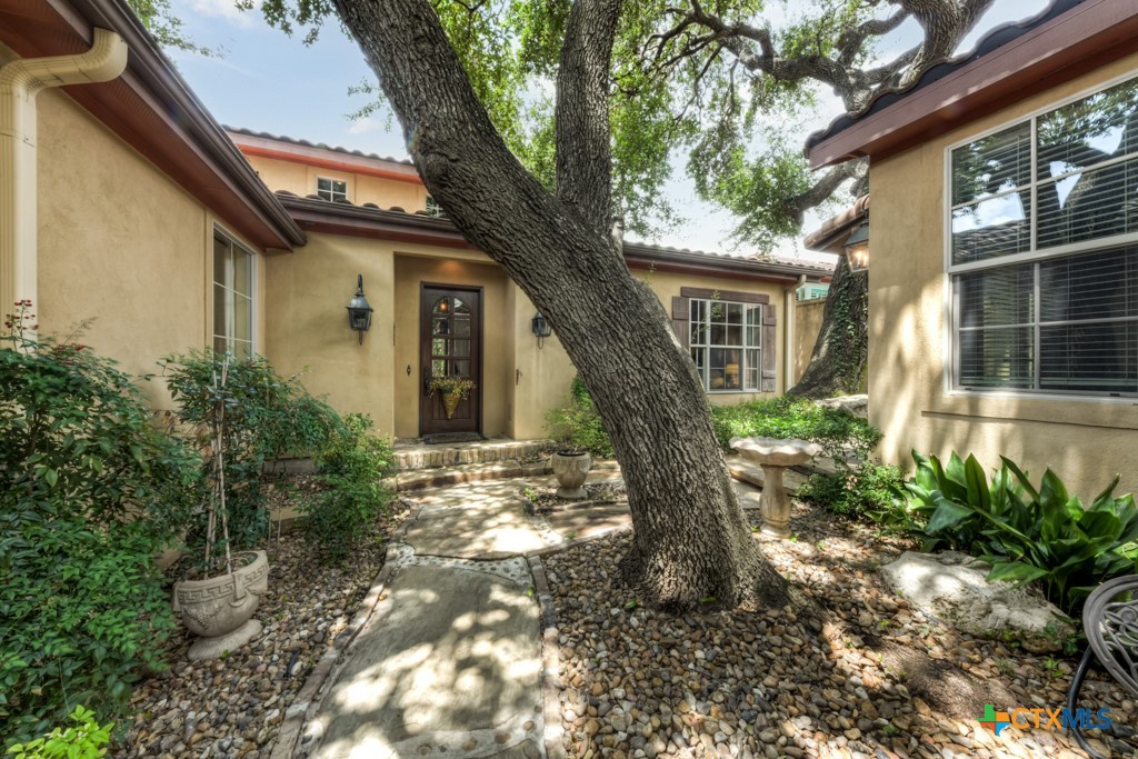 1108 Tuscan Ridge Drive New Braunfels, TX 78130 - Photo 5 of 47 a front view of a house with garden