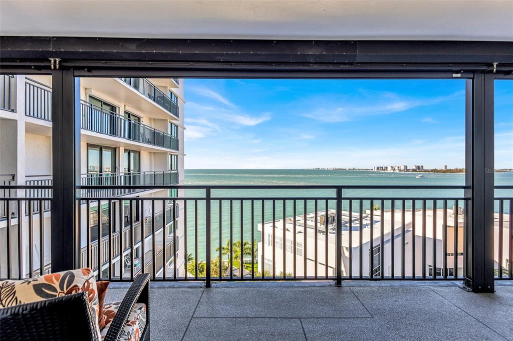 4822 Ocean Boulevard, Unit 8D Siesta Key, FL 34242 - Photo 17 of 69 a view of a balcony with furniture