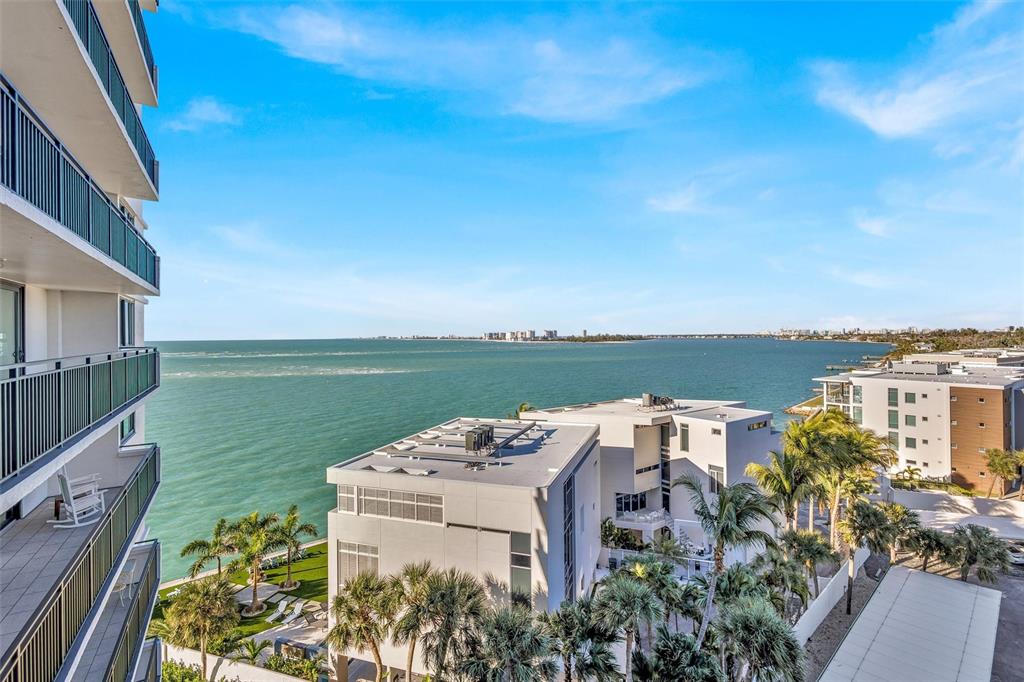 4822 Ocean Boulevard, Unit 8D Siesta Key, FL 34242 - Photo 19 of 69 an aerial view of a house with outdoor space lake view and tall trees