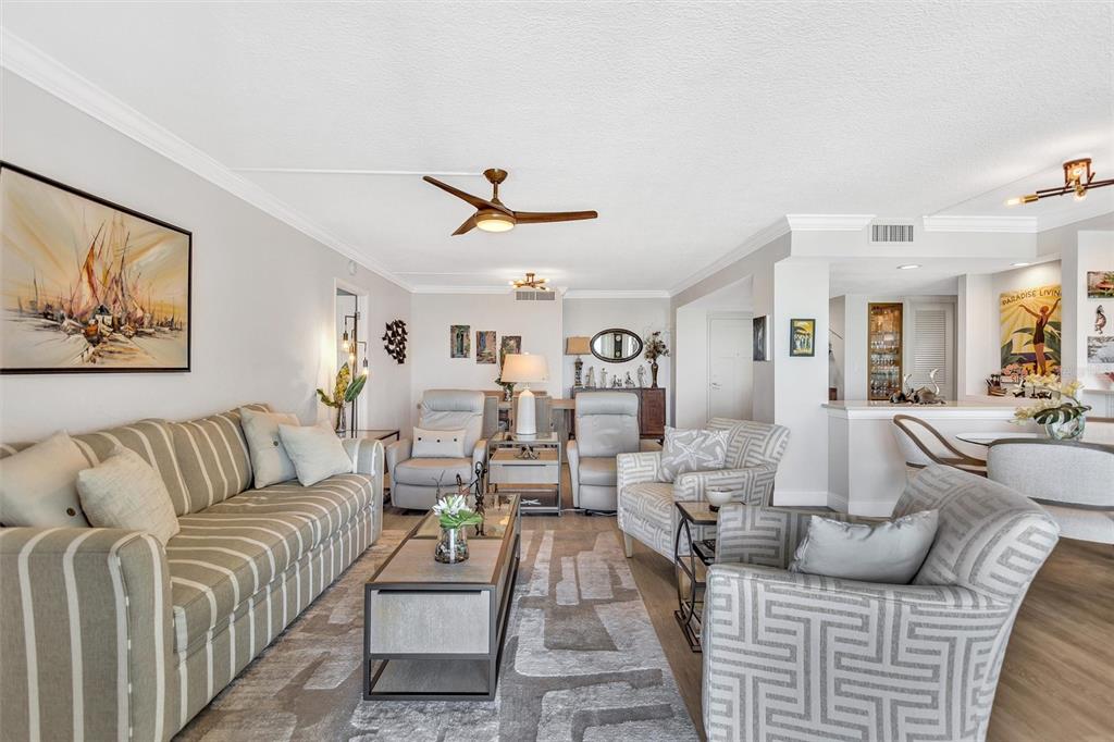 4822 Ocean Boulevard, Unit 8D Siesta Key, FL 34242 - Photo 22 of 69 a living room with furniture kitchen view and a rug