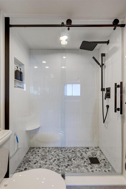 4822 Ocean Boulevard, Unit 8D Siesta Key, FL 34242 - Photo 30 of 69 a bathroom with a sink and a mirror