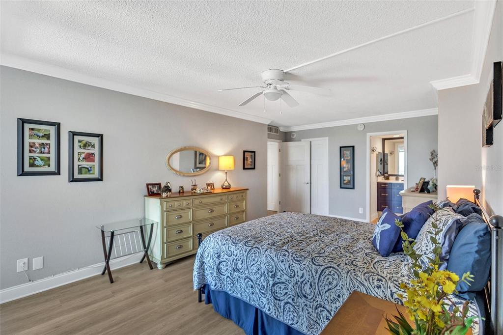 4822 Ocean Boulevard, Unit 8D Siesta Key, FL 34242 - Photo 44 of 69 a bedroom with a bed and dresser