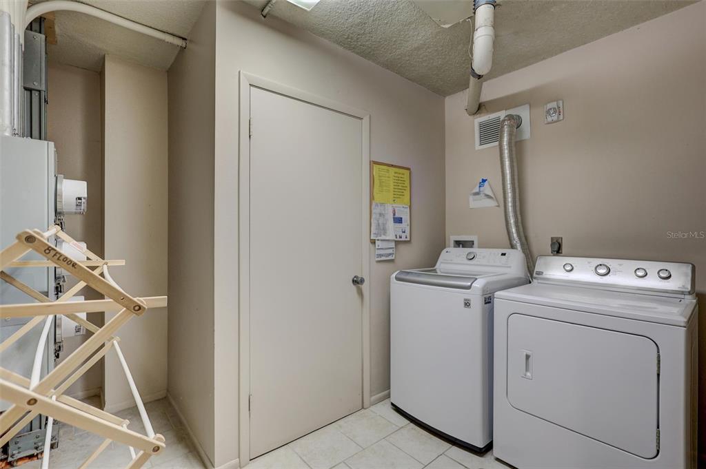 4822 Ocean Boulevard, Unit 8D Siesta Key, FL 34242 - Photo 48 of 69 a view of storage and utility room with washer and dryer