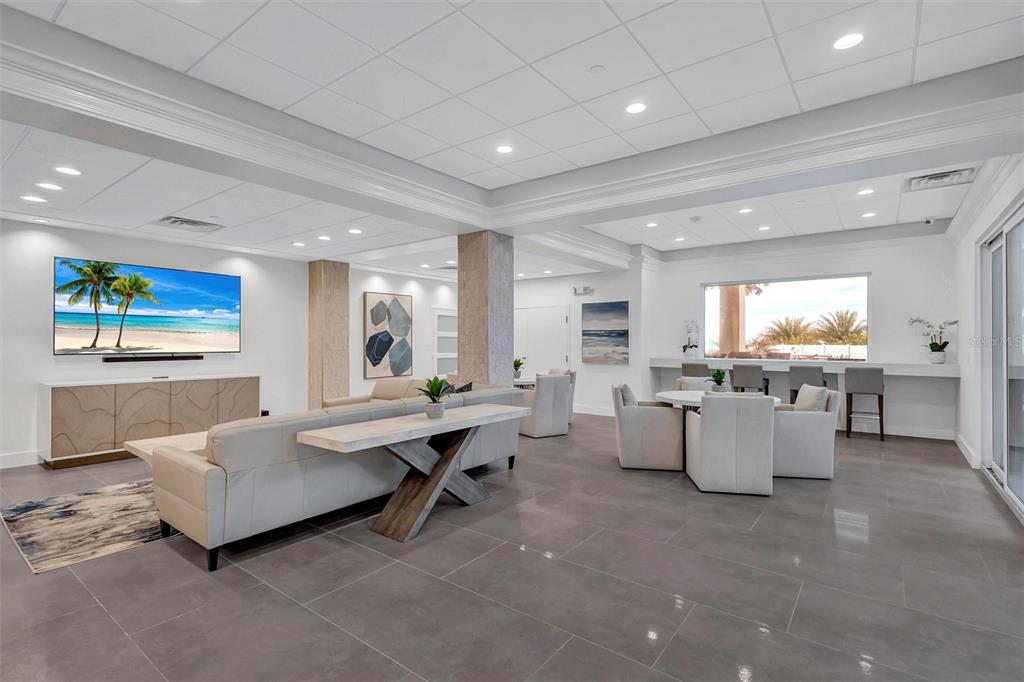 4822 Ocean Boulevard, Unit 8D Siesta Key, FL 34242 - Photo 50 of 69 a living room with furniture and a large window