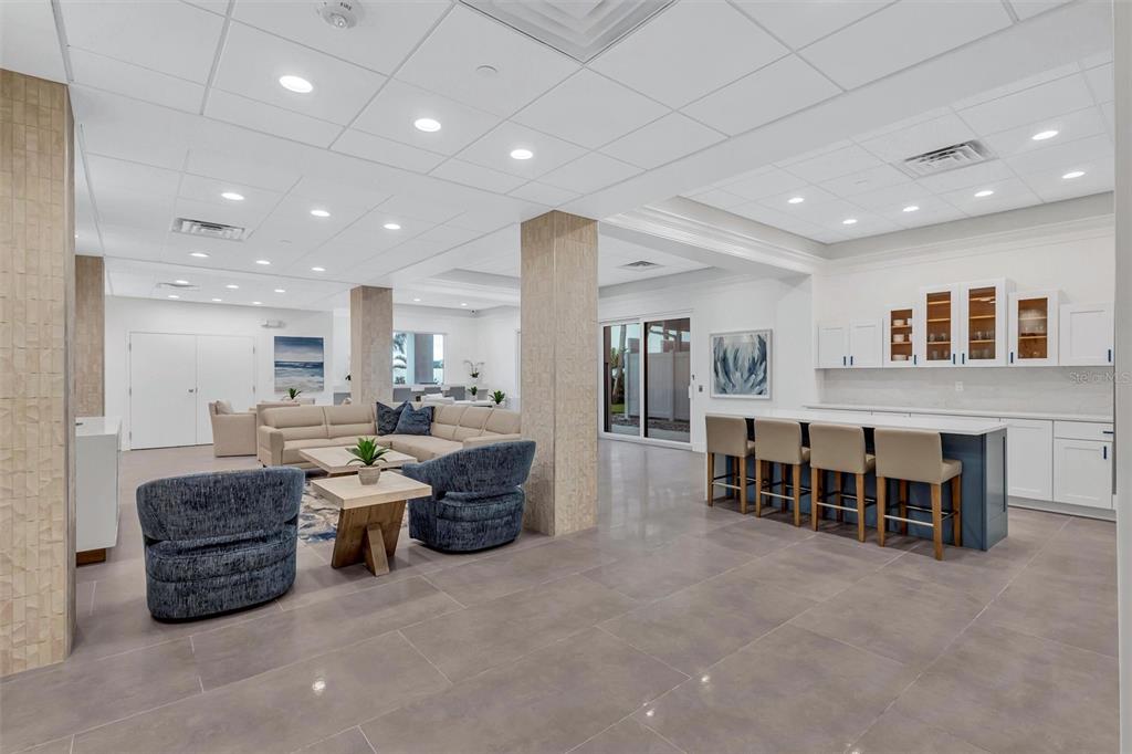 4822 Ocean Boulevard, Unit 8D Siesta Key, FL 34242 - Photo 52 of 69 a living room with furniture and kitchen view