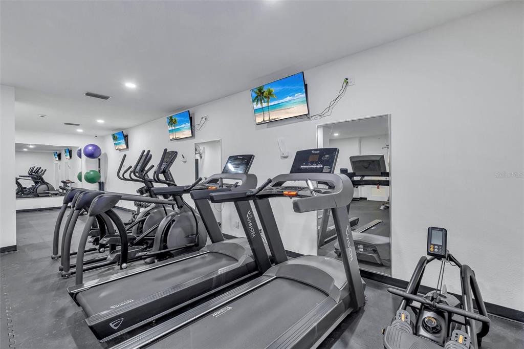 4822 Ocean Boulevard, Unit 8D Siesta Key, FL 34242 - Photo 56 of 69 a view of a room with gym equipment