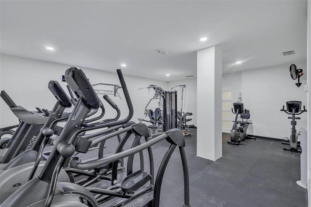 4822 Ocean Boulevard, Unit 8D Siesta Key, FL 34242 - Photo 58 of 69 a view of a room with gym equipment