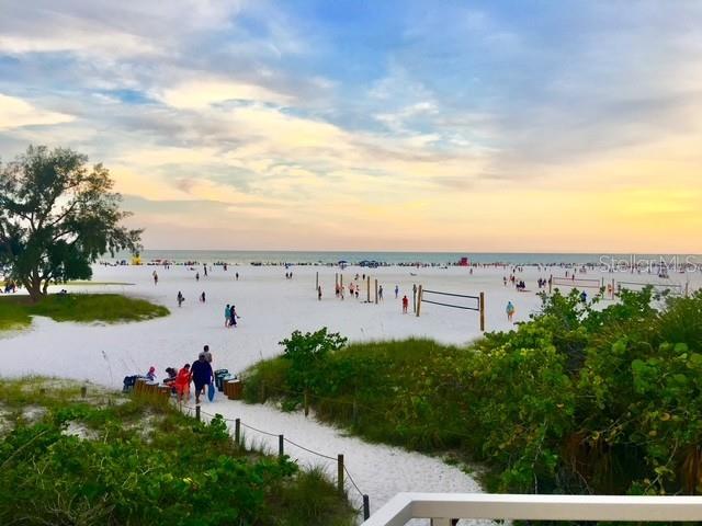 4822 Ocean Boulevard, Unit 8D Siesta Key, FL 34242 - Photo 65 of 69 a view of a lake with a building in the background