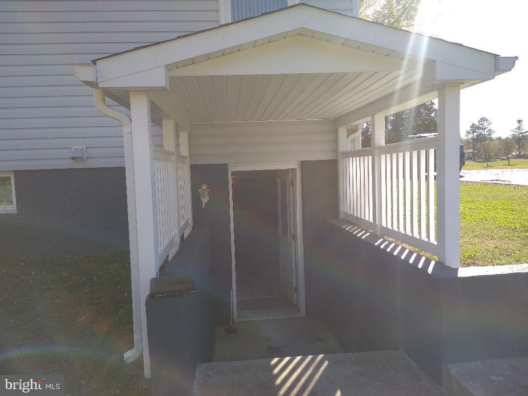 9545 Dubois Road Charlotte Hall, MD 20622 - Photo 29 of 32 Covered basement entrance