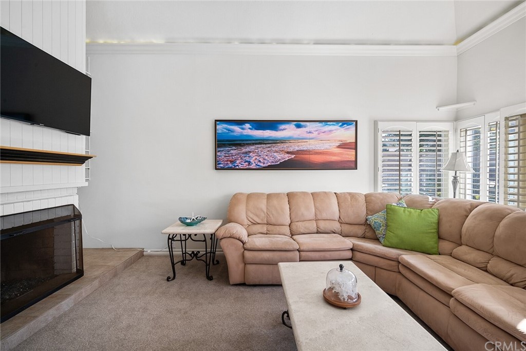 23892 Taranto Bay Dana Point, CA 92629 - Photo 12 of 73 a living room with furniture and a fireplace