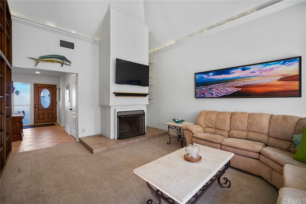 23892 Taranto Bay Dana Point, CA 92629 - Photo 13 of 73 a living room with furniture and a flat screen tv
