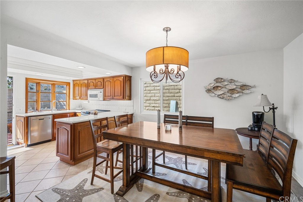 23892 Taranto Bay Dana Point, CA 92629 - Photo 16 of 73 a view of a dining room with furniture window and wooden floor