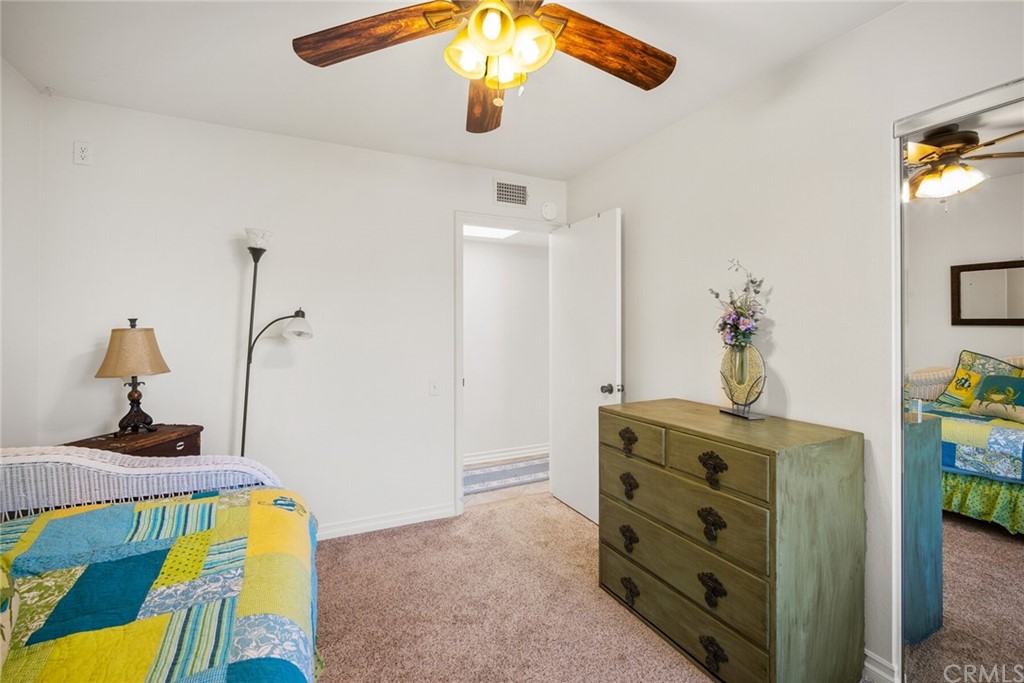 23892 Taranto Bay Dana Point, CA 92629 - Photo 30 of 73 a bedroom with a bed and ceiling fan
