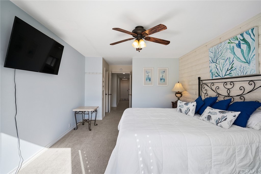 23892 Taranto Bay Dana Point, CA 92629 - Photo 34 of 73 a bedroom with a bed and a flat screen tv