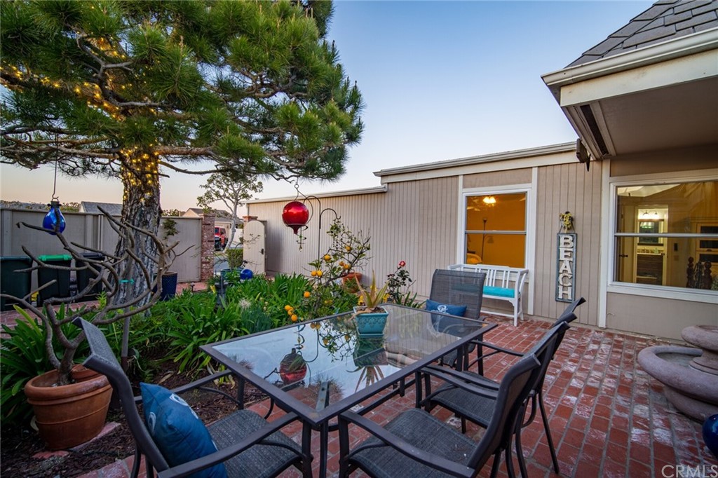 23892 Taranto Bay Dana Point, CA 92629 - Photo 36 of 73 a outdoor dining space with furniture and potted plants