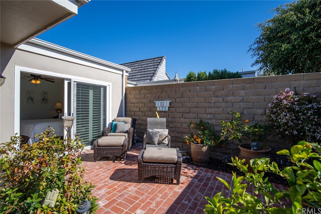23892 Taranto Bay Dana Point, CA 92629 - Photo 40 of 73 a front view of a house with a garden