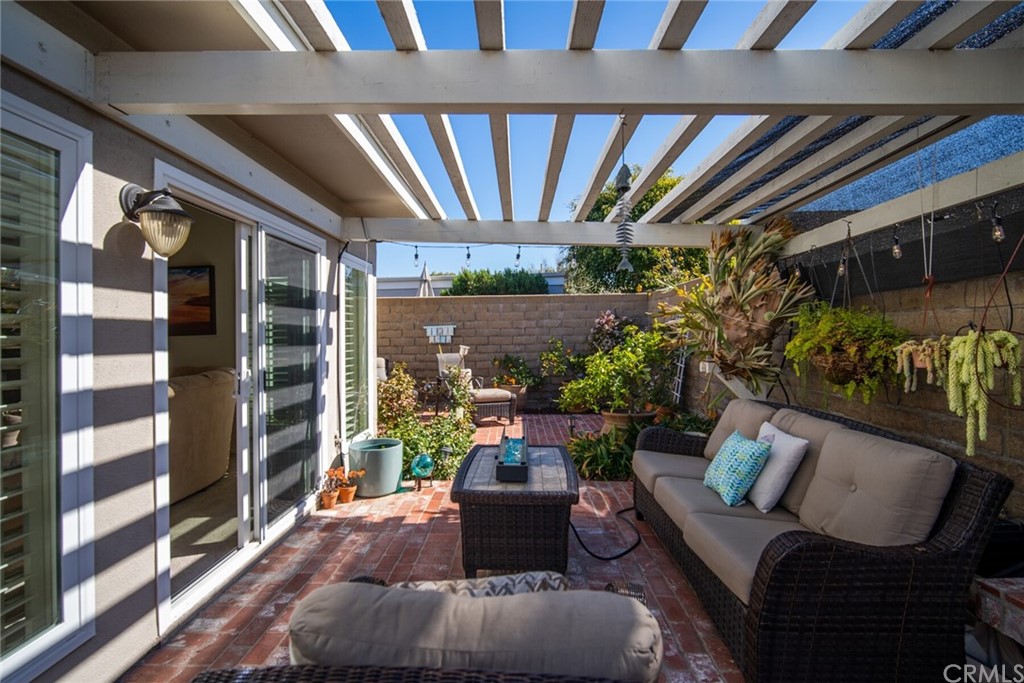 23892 Taranto Bay Dana Point, CA 92629 - Photo 44 of 73 a living room with furniture and a floor to ceiling window