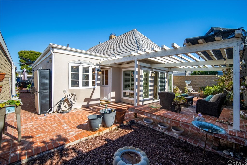 23892 Taranto Bay Dana Point, CA 92629 - Photo 45 of 73 a view of a house with backyard sitting area and porch