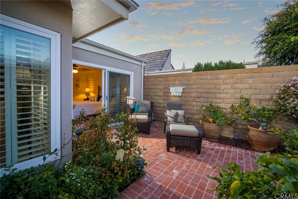 23892 Taranto Bay Dana Point, CA 92629 - Photo 48 of 73 a view of a patio with couches table and chairs and potted plants