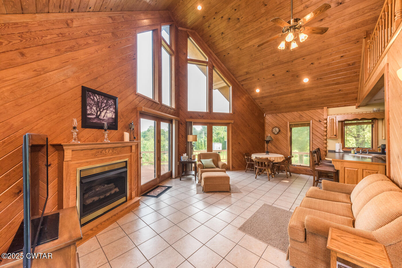 3490 Coffee Landing Road Morris Chapel, TN 38361 - Photo 25 of 39 a living room with furniture a fireplace and a flat screen tv