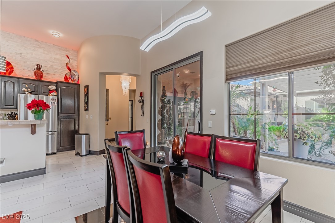 17 Chatmoss Road Henderson, NV 89052 - Photo 13 of 58 Dining space with light tile patterned flooring