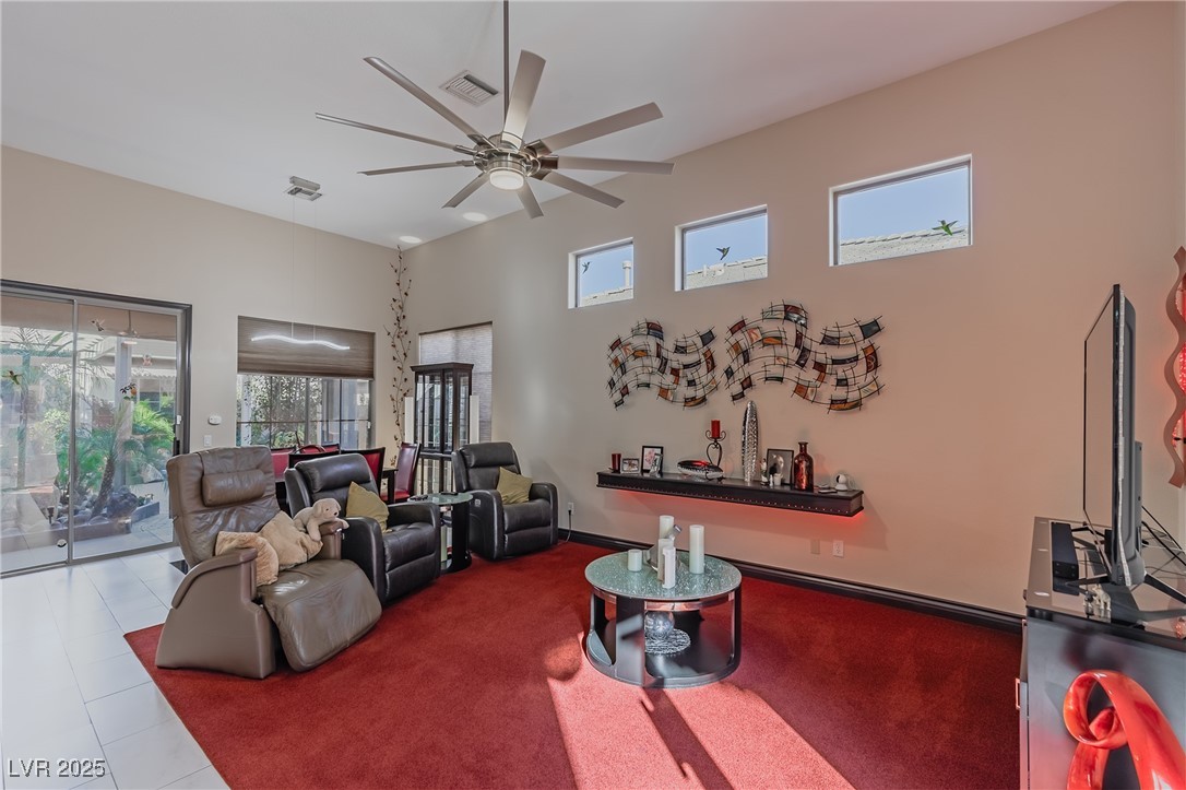 17 Chatmoss Road Henderson, NV 89052 - Photo 14 of 58 living room featuring a high ceiling, ceiling fan, baseboards, and visible vents
