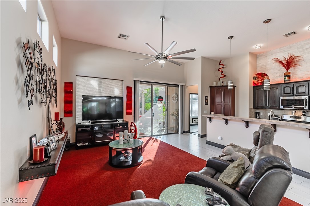 17 Chatmoss Road Henderson, NV 89052 - Photo 17 of 58 Living room with visible vents and a ceiling fan