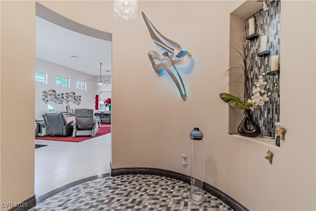 17 Chatmoss Road Henderson, NV 89052 - Photo 27 of 58 Hall featuring a notable chandelier
