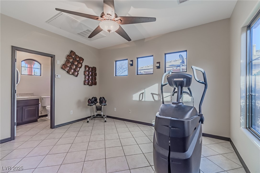 17 Chatmoss Road Henderson, NV 89052 - Photo 33 of 58 Casita with private bathroom with light tile patterned floors, a healthy amount of sunlight, and ceiling fan