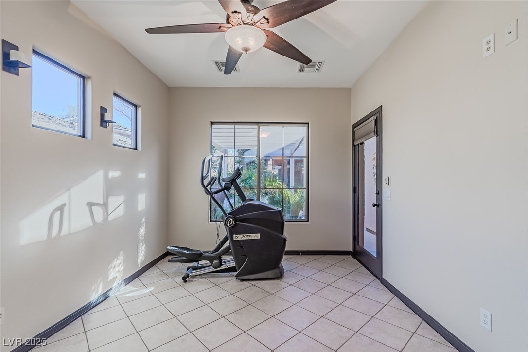 17 Chatmoss Road Henderson, NV 89052 - Photo 34 of 58 Casita separate from main home. light tile patterned floors, visible vents, a ceiling fan, and baseboards