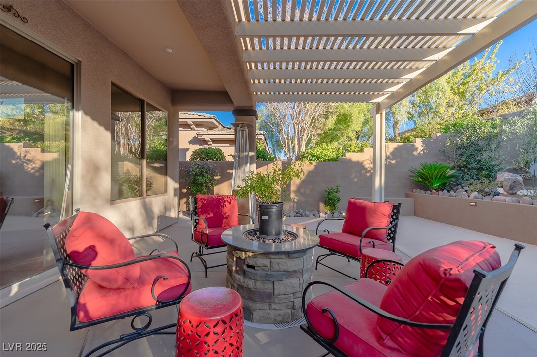 17 Chatmoss Road Henderson, NV 89052 - Photo 38 of 58 View of patio with an outdoor hangout area, a pergola, and fence