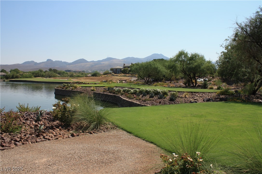 17 Chatmoss Road Henderson, NV 89052 - Photo 52 of 58 Surrounding community with a water and mountain view and a lawn