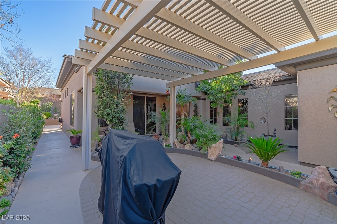 17 Chatmoss Road Henderson, NV 89052 - Photo 6 of 58 View of courtyard terrace featuring a pergola and a grill