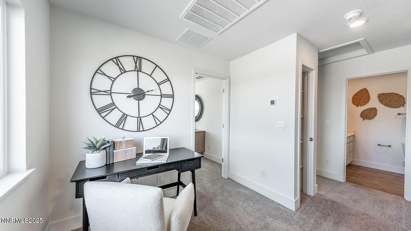 5861 Morgan Horse Street Reno, NV 89523 - Photo 15 of 25 a living room with a table and a mirror