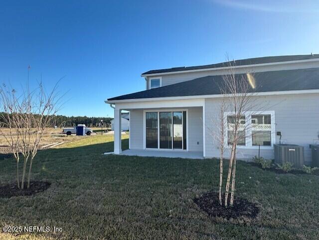 156 Camphor Laurel Road St. Augustine, FL 32092 - Photo 26 of 34 a view of a house with backyard and garden