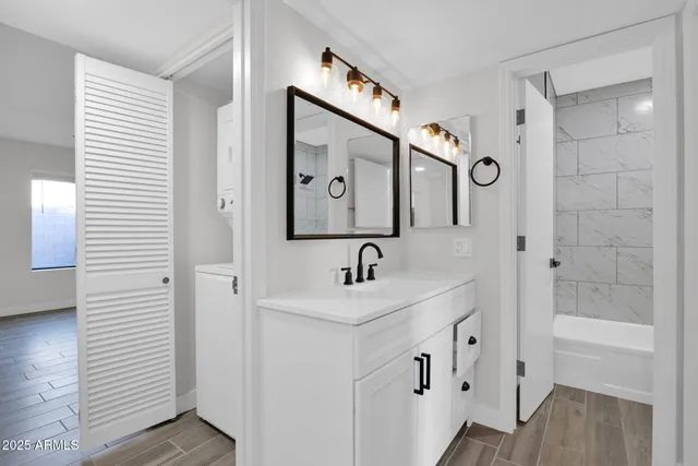 a bathroom with a sink and a mirror