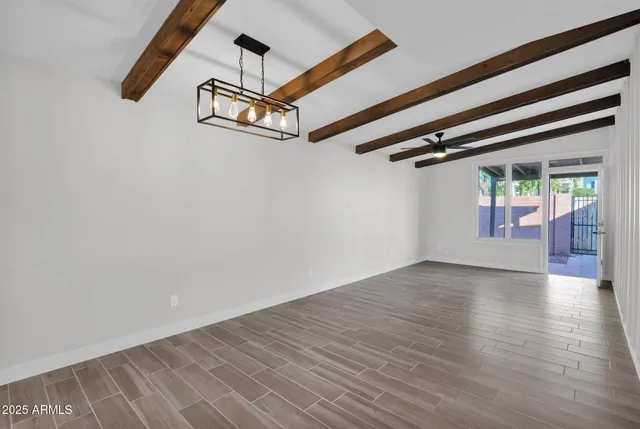 wooden floor in a hall with a window
