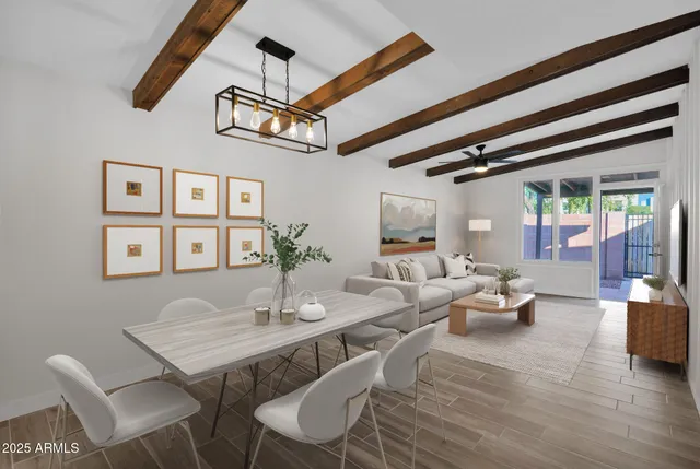 a view of a dining room with furniture window and wooden floor
