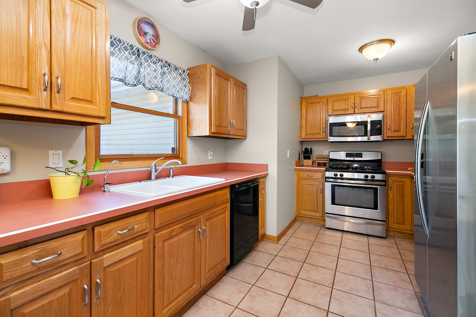 450 South Walnut Street Manteno, IL 60950 - Photo 6 of 14 a kitchen with stainless steel appliances a stove sink and cabinets