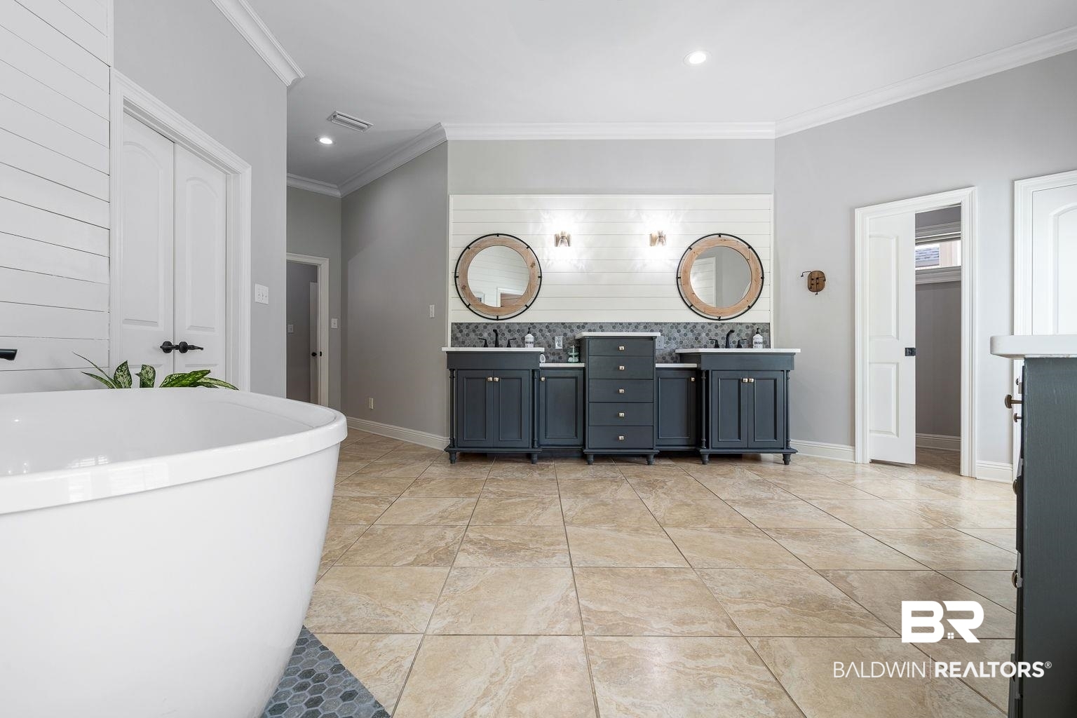 23357 Carnoustie Drive Foley, AL 36535 - Photo 53 of 99 Full bathroom featuring double vanity, crown molding, a freestanding tub, recessed lighting, and tile patterned floors